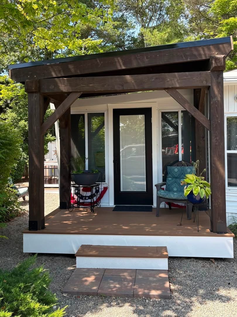 Custom covered porch with stained timber posts