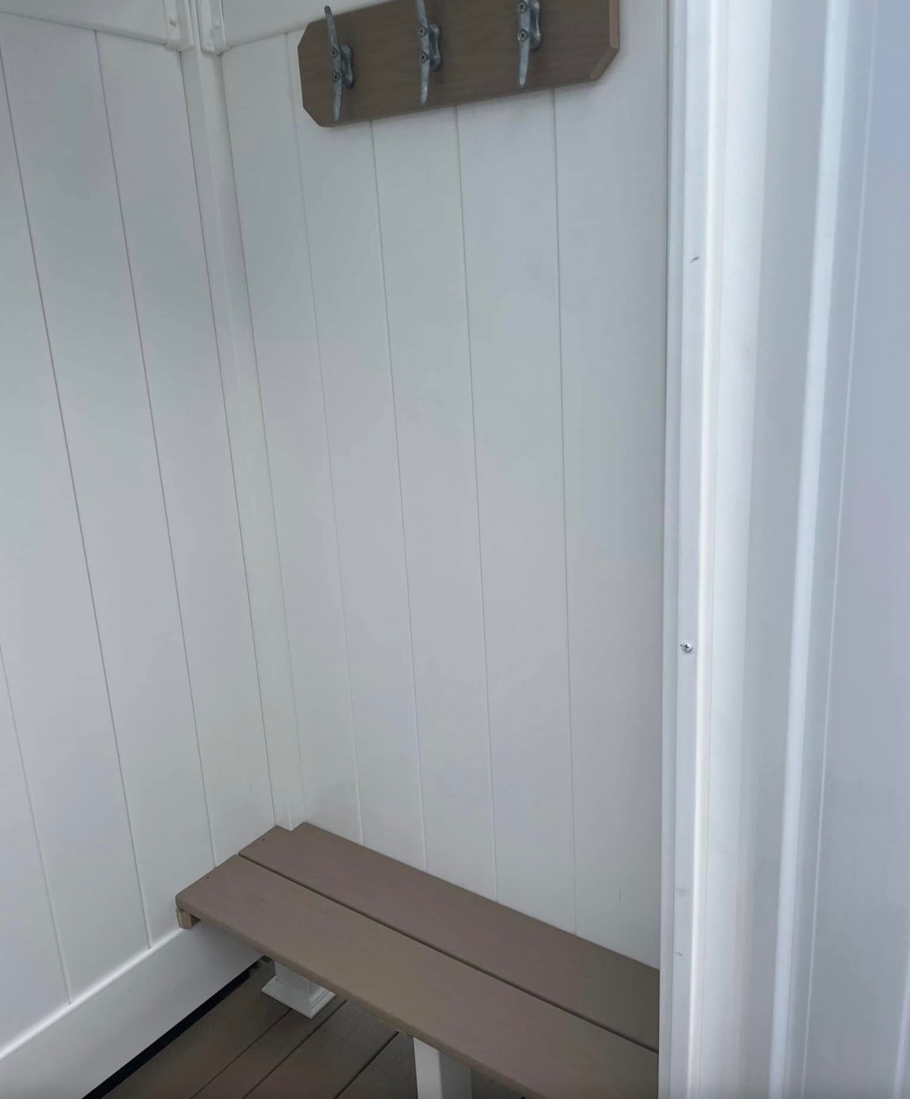 Inside, with a bench and cleat hooks